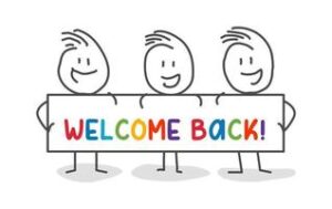 Children holding welcome back sign
